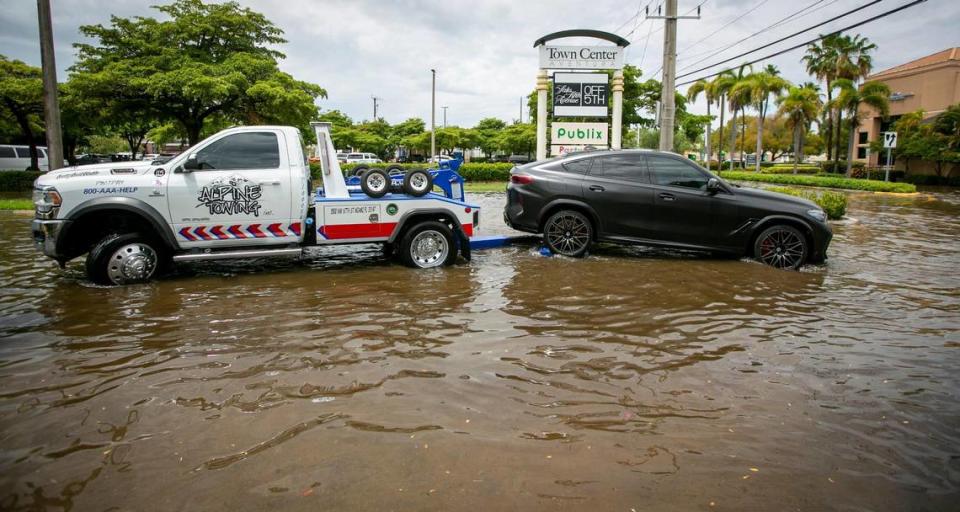 Aventura, Florida - April 24, 2023 - A disabled vehicle gets towed away from the corner of North East 191th street and 28th Avenue in Aventura. Heavy rainstorms and flooding are expected in the Miami and Fort Lauderdale area Monday and Tuesday.