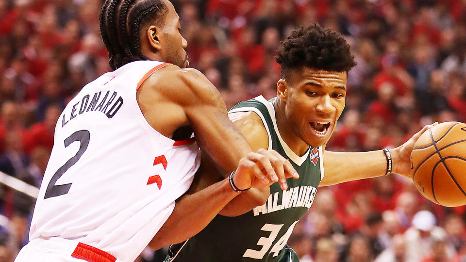 Reigning NBA MVP Giannis Antetokpunmpo, pictured battling Kawhi Leonard, will be a top pick for many fantasy players.