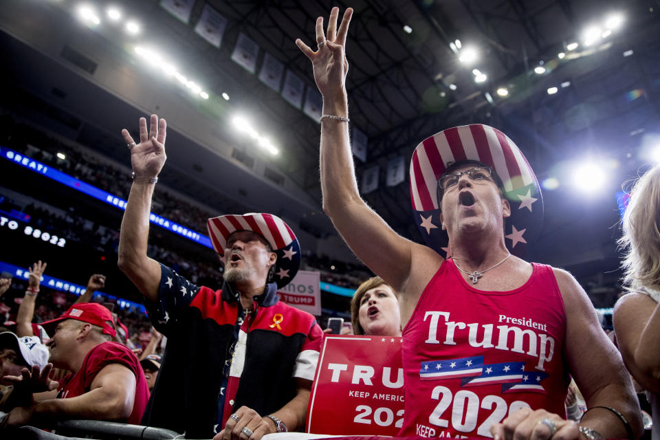 Members of the audience wear "Trump 2020" cowboy hats and chant, "Four More Years," as President Donald Trump speaks at a campaign rally at American Airlines Arena in Dallas, Texas, Thursday, Oct. 17, 2019. (AP Photo/Andrew Harnik)