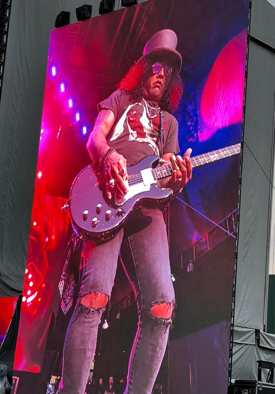 Slash, guitarist for Guns N' Roses," is shown on a video screen during the band's concert on Friday at PNC Park in downtown Pittsburgh.