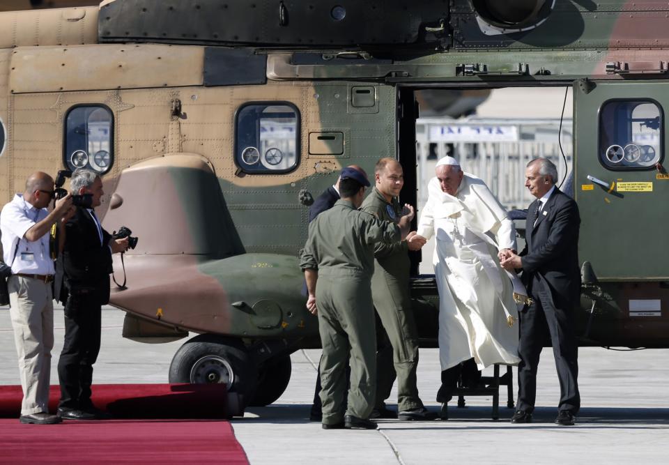 Pope Francis disembarks from a helicopter after landing at Ben Gurion airport near Tel Aviv