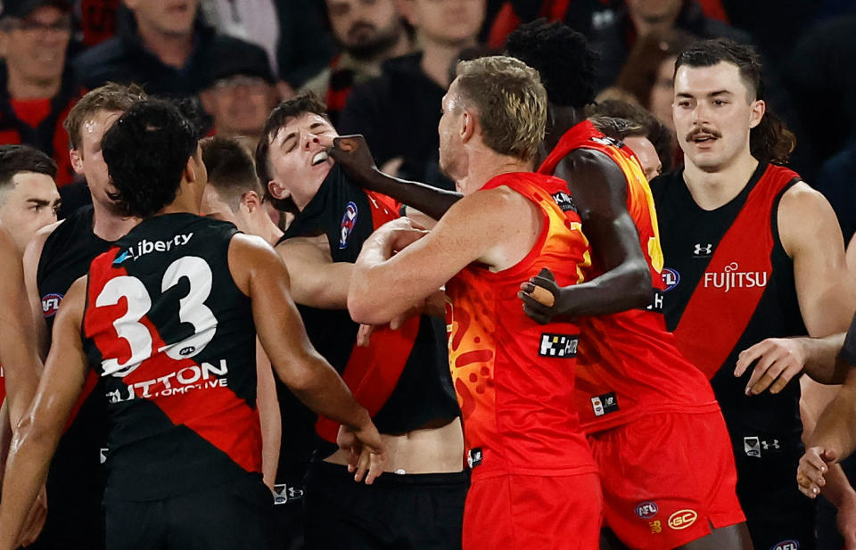 MELBOURNE, AUSTRALIA - AUGUST 10: Mac Andrew of the Suns and Archie Roberts of the Bombers clash during the 2024 AFL Round 22 match between the Essendon Bombers and the Gold Coast SUNS at Marvel Stadium on August 10, 2024 in Melbourne, Australia. (Photo by Michael Willson/AFL Photos via Getty Images)