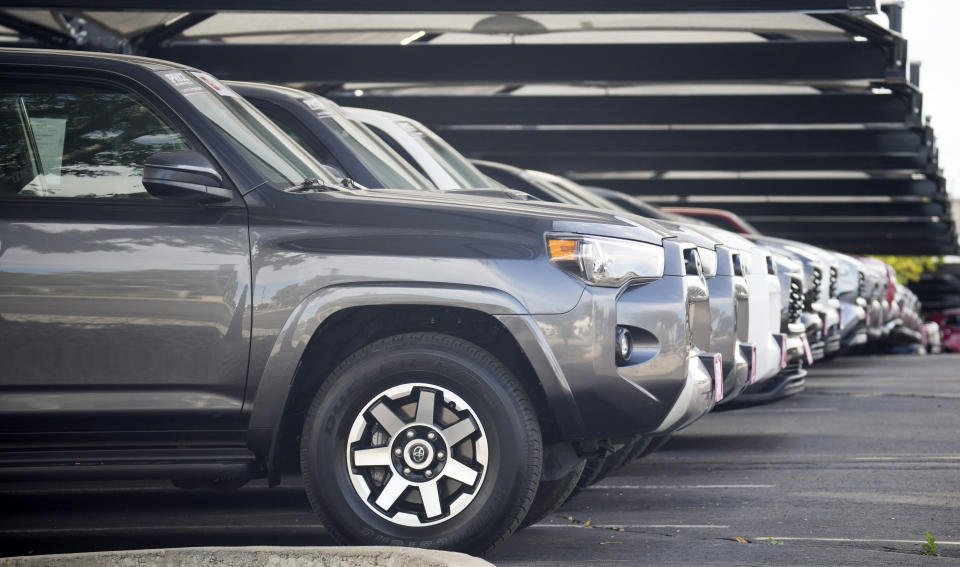 A long row of unsold 2023 4Runner sports-utility vehicles sits at a Toyota dealership Tuesday, Oct. 10, 2023, in Centennial, Colo. (AP Photo/David Zalubowski)