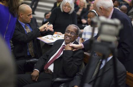 James F. Wells (C) greets supporters after a group of black civil rights protesters nicknamed the "Friendship Nine" appeared at a courthouse to have their trespassing convictions vacated in Rock Hill, South Carolina January 28, 2015. REUTERS/Jason Miczek