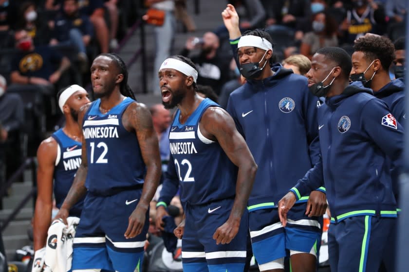 Patrick Beverley (22) reacts from the Minnesota Timberwolves bench during a preseason game