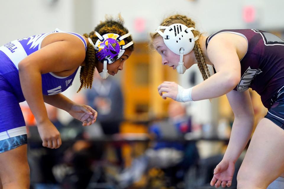 Ari Tyson of Cherry Hill West, left, and Kailin Lee of Newton/Kittatinny wrestle during the NJSIAA girls state wrestling semifinals at Phillipsburg High School on Sunday, Feb. 26, 2023.