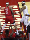 Los Angeles Lakers forward Markieff Morris (88) pushes Houston Rockets center DeMarcus Cousins (15) as they get into an altercation during the first quarter of an NBA basketball game on Sunday, Jan. 10, 2021, at Toyota Center in Houston. Morris was ejected from the game after the incident. (Brett Coomer/Houston Chronicle via AP)