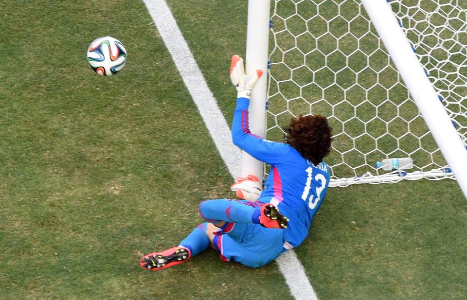 Mexico's goalkeeper Guillermo Ochoa makes a save during the group A World Cup soccer match between Brazil and Mexico at the Arena Castelao in Fortaleza, Brazil, Tuesday, June 17, 2014. (AP Photo/Francois Xavier Marit)