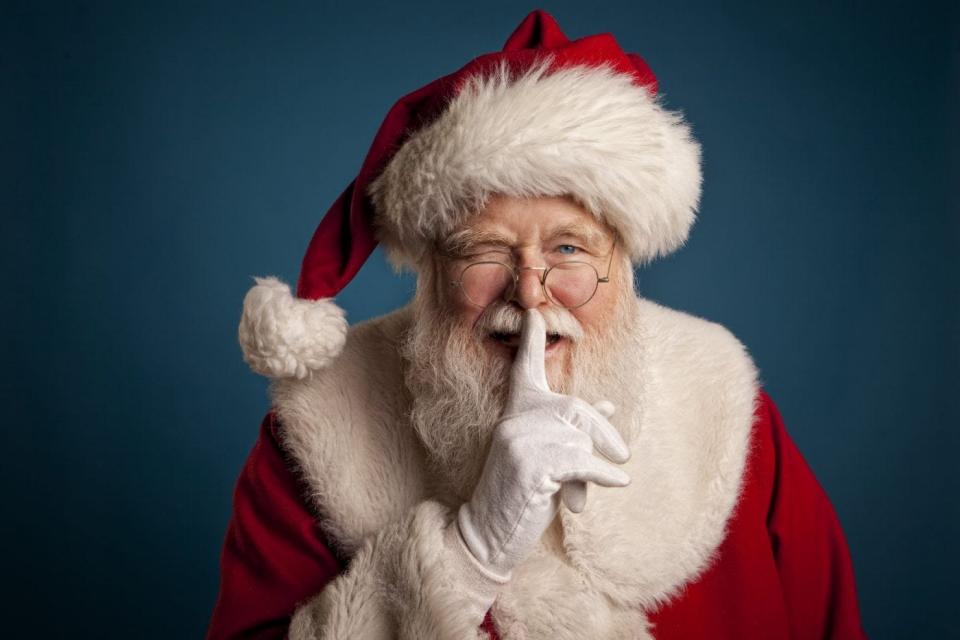Santa winking at camera with secret.