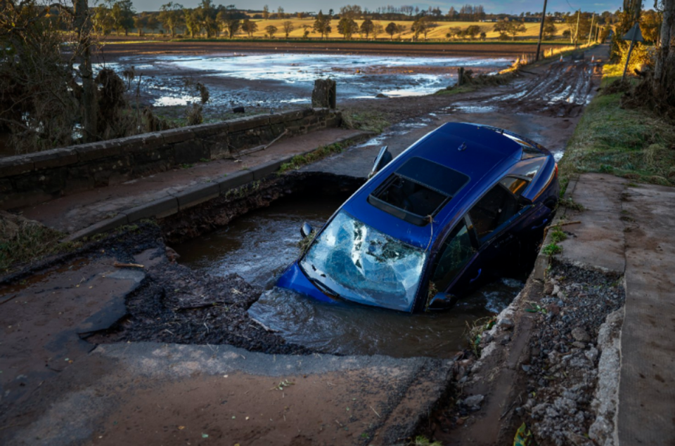 A different car is seen on bridge washed away following yesterday’s torrential rain on October 21, 2023 in Dundee (Getty Images)