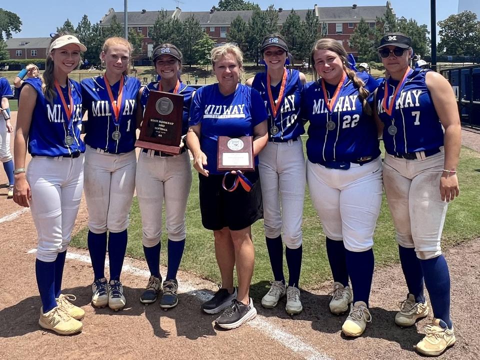 Midway softball coach Susan Clark (center) and 2023 seniors, from left, Jacie Byrd, Lainey Hughes, Mallory Baggett, Leah Culbreth, Kasey Calcutt and Krista McLean. The Raiders finished as NCHSAA 2A state runners-up and East Regional champs.