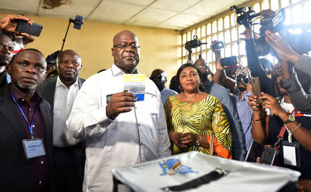 FILE PHOTO: Felix Tshisekedi, leader of the Congolese main opposition party, the Union for Democracy and Social Progress (UDPS), and a presidential candidate, casts his ballot at a polling station in Kinshasa, Democratic Republic of Congo, December 30, 2018. REUTERS/Olivia Acland/File Photo