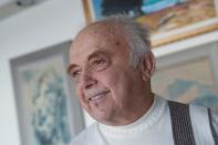 Yehuda Evron poses at his apartment in the Queens borough of New York