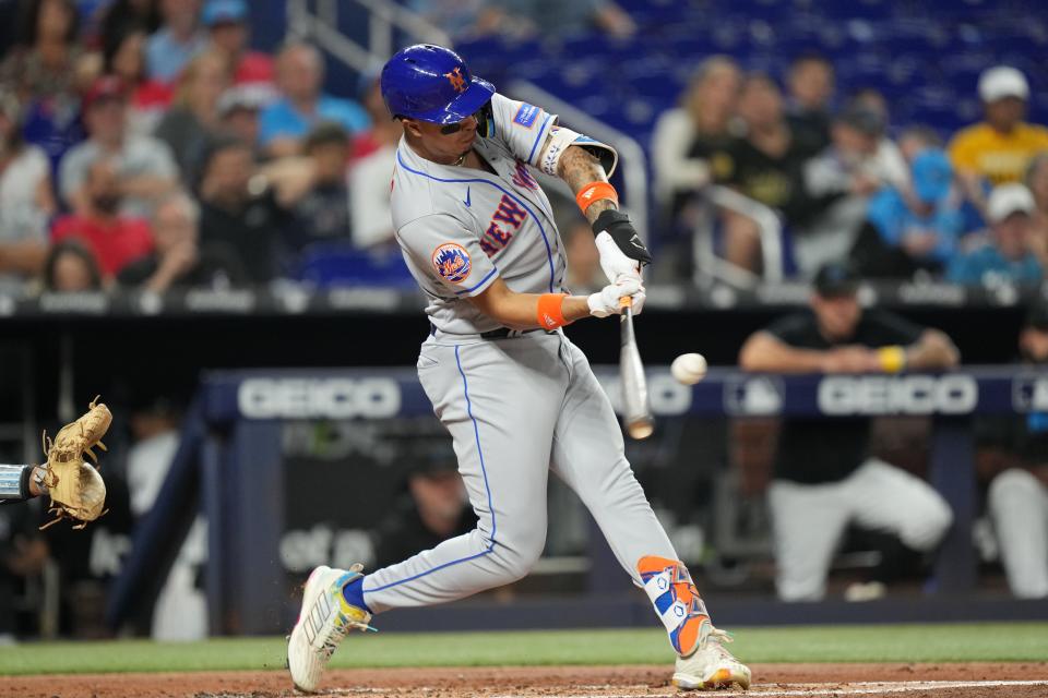 New York Mets designated hitter Mark Vientos (27) hits a solo home run in the second inning against the Miami Marlins on Sept. 20, 2023, at loanDepot Park.