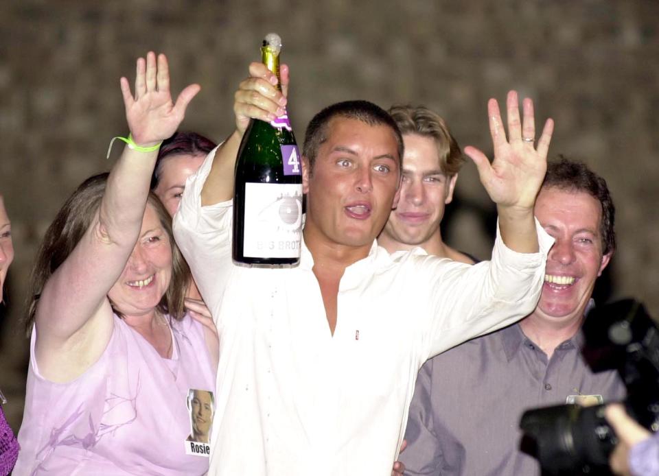 Air steward Brian Dowling, the winner of the channel 4's 'Big Brother' show, celebrates with his parents, after winning the  70,000 prize money.   (Photo by John Stillwell - PA Images/PA Images via Getty Images)