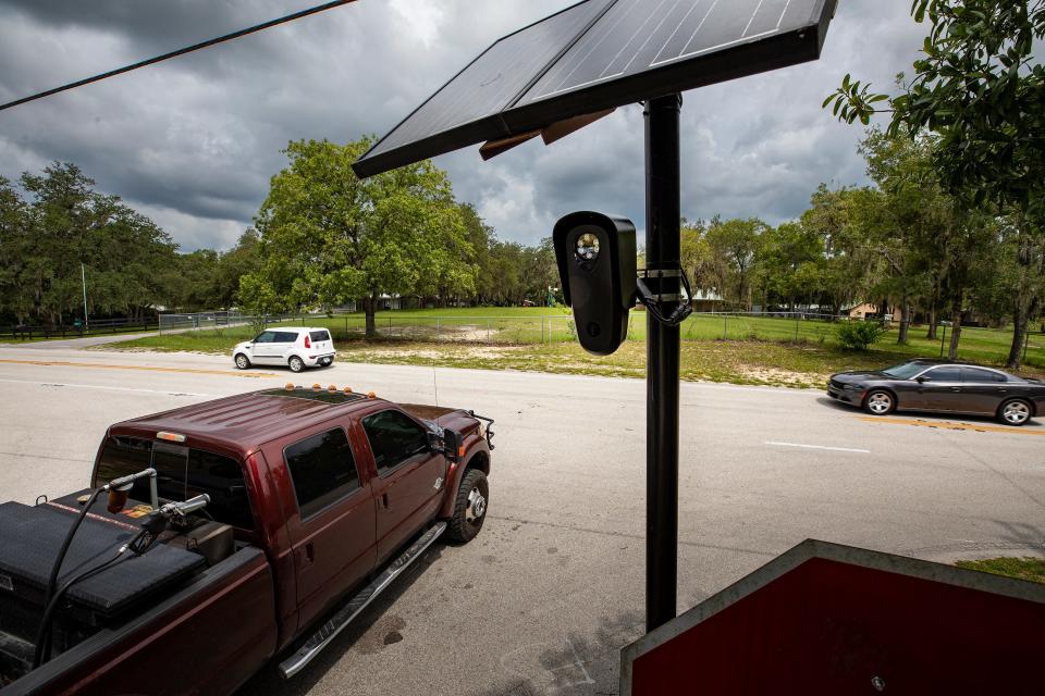 A Flock Safety camera at Timberridge Drive and Old Polk City Road in Lakeland. Data collected from scanned vehicles is uploaded to Flock's national database 24/7, and is then searchable by any of the system's users.