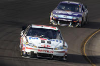AVONDALE, AZ - NOVEMBER 13: Tony Stewart, driver of the #14 Office Depot/Mobil 1 Chevrolet, leads Matt Kenseth, driver of the #17 Crown Royal Ford, during the NASCAR Sprint Cup Series Kobalt Tools 500 at Phoenix International Raceway on November 13, 2011 in Avondale, Arizona. (Photo by Christian Petersen/Getty Images)