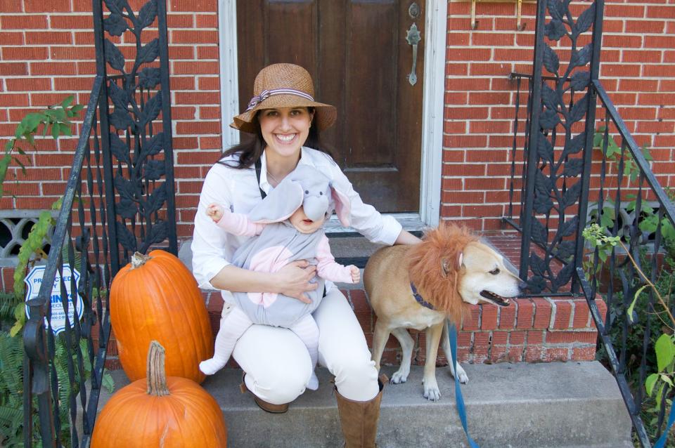Mom posing with baby and dog for Halloween