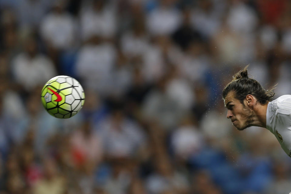 FILE - Real Madrid's Gareth Bale heads the ball to score the opening goal against Real Betis during a Spanish La Liga soccer match between Real Madrid and Real Betis at the Santiago Bernabeu stadium in Madrid, Saturday, Aug. 29, 2015. (AP Photo/Francisco Seco, File)