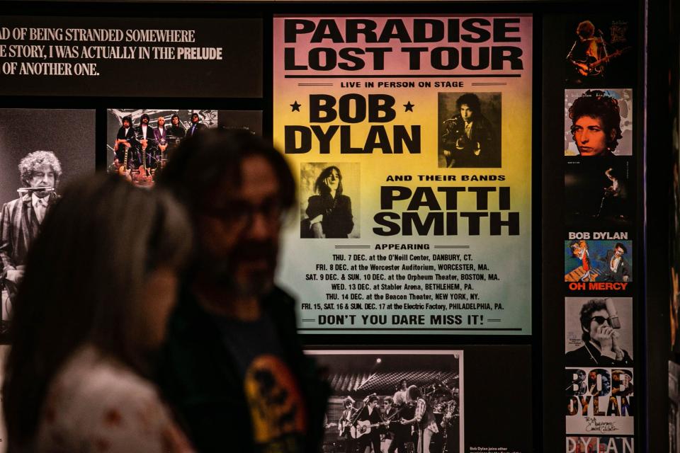 VIP guests and media walk though an exhibit Saturday during the grand opening tour of the Bob Dylan Center in Tulsa.