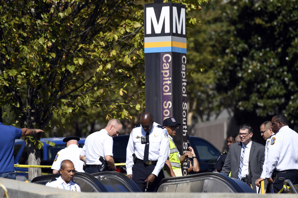 Police gather near the Capitol South Station Metro stop near the U.S. Capitol in Washington, Friday, Oct. 11, 2019. Police say a boy has been stabbed and seriously injured near the Capitol. The Metropolitan Police Department says officers are looking for a 14-year-old girl in connection with the stabbing. (AP Photo/Susan Walsh)