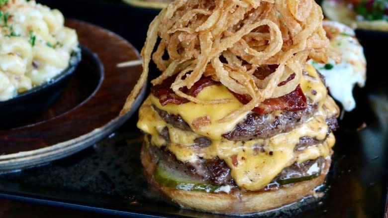 Triple cheeseburger with fried onion straws