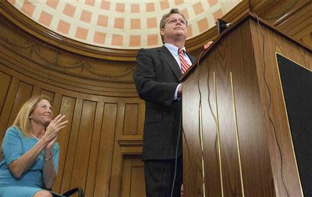 Katherine Anne Gershman applauds as her husband Ted Kennedy Jr. (R), the son of late Democratic Massachusetts Senator Edward M. Kennedy, declares his candidacy for a seat in the Connecticut Senate, in Branford, Connecticut April 8, 2014. REUTERS/Michelle McLoughlin