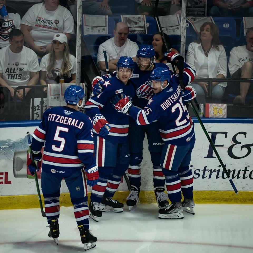 Rochester Americans celebrate Mark Jankowski's (14) goal only 20 seconds into the first period in their 2nd game against the Utica Comets during the 2022 Calder Cup Playoffs on Saturday, May 14, 2022 at the Adirondack Bank Center in Utica.