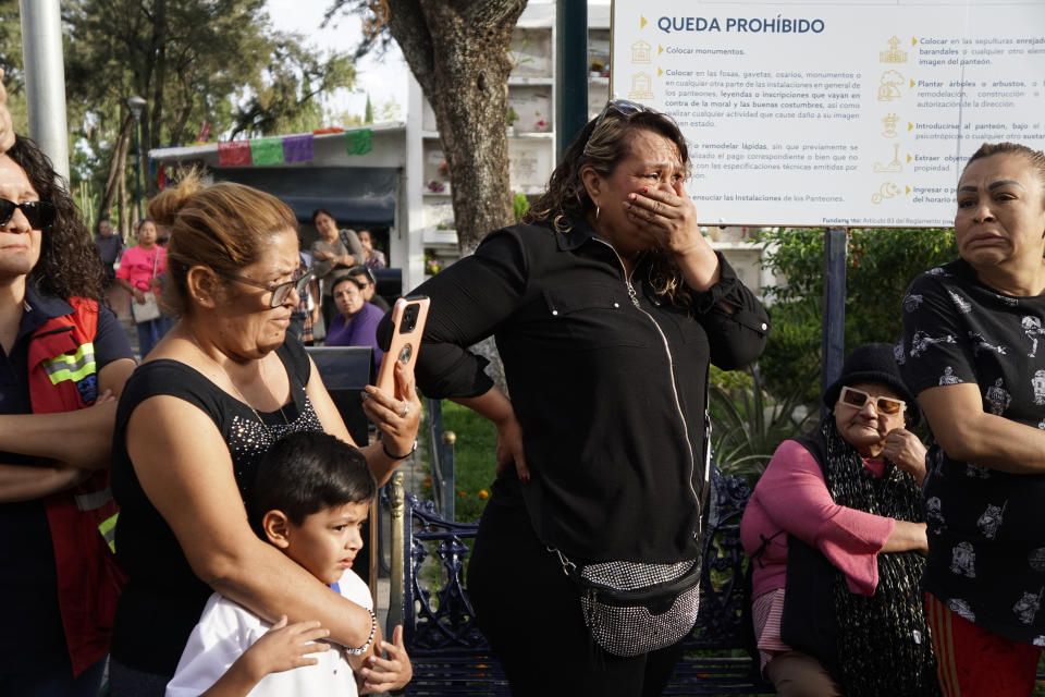 Friends and family of slain activist Adolfo Enriquez Vanderkam mourn at his funeral in Leon, Guanajuato state, Mexico, Thursday, Nov. 23, 2023. Enríquez Vanderkam was shot Wednesday night as he was leaving a taco shop. (AP Photo/Mario Armas)