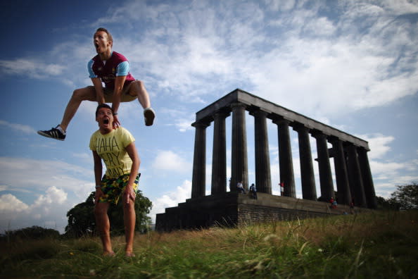 Members of the InSTEP theatre group take part in a photocall on Calton Hill to promote their show at the Edinburgh Fringe, 'Departure Lounge,' on August 6, 2012 in Edinburgh, Scotland. The Edinburgh Festival Fringe is the largest arts festivals in the world, it was established as an alternative to the International Festival also held in August, and celebrates it's 66th anniversary this year. (Photo by Dan Kitwood/Getty Images)