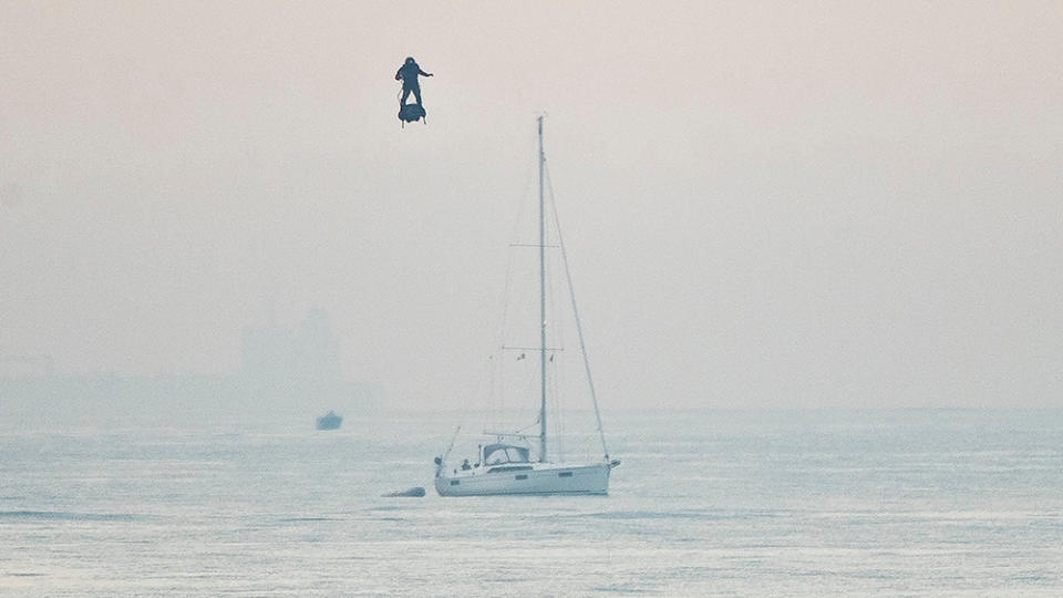 French inventor Franky Zapata passes near a sailing yacht as he heads to St Margarets Bay near Dover crossing the English Channel on his jet-powered hoverboard.Hoverboard Channel crossing attempt, Dover, UK - 04 Aug 2019French inventor Franky Zapata made the 35km crossing with a refueling stop mid channel to reach the English coast after setting off at 6:15am French time.
