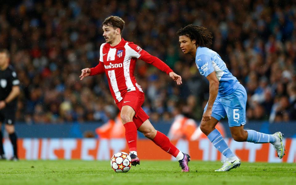 Antoine Griezmann of Atletico Madrid takes the ball away from Nathan Ake of Manchester City - Daniel Chesterton/Offside/Offside via Getty Images