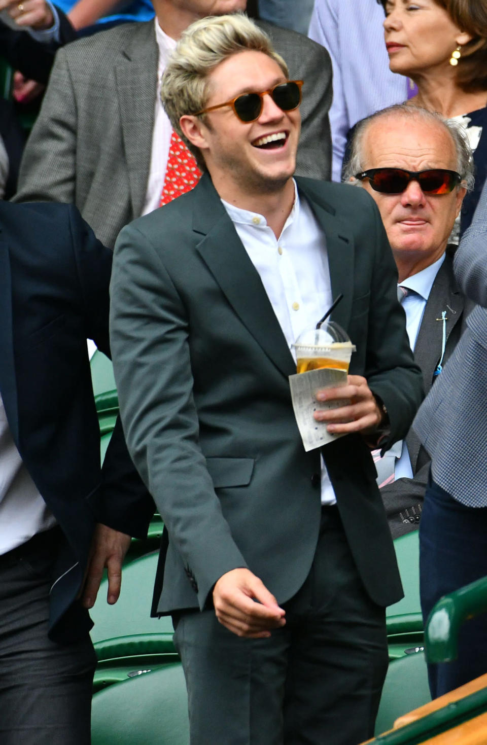 <p>Who knew the One Direction star was such a tennis fan? Niall made his second appearance at Wimbledon in as many days, wearing a smart moss green suit. <i>[Photo: Rex]</i></p>