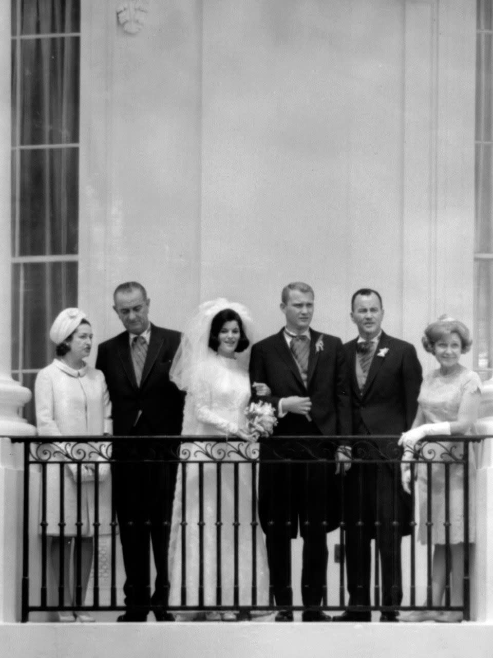 Luci Baines Johnson and Patrick Nugent and their parents on the south portico, 6 August 1966