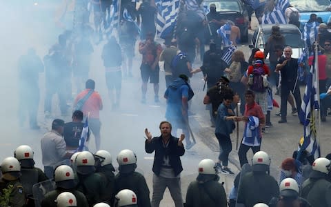 Riot police faced protesters as the foreign ministers of Greece and Macedonia signed the historic preliminary accord - Credit: AFP