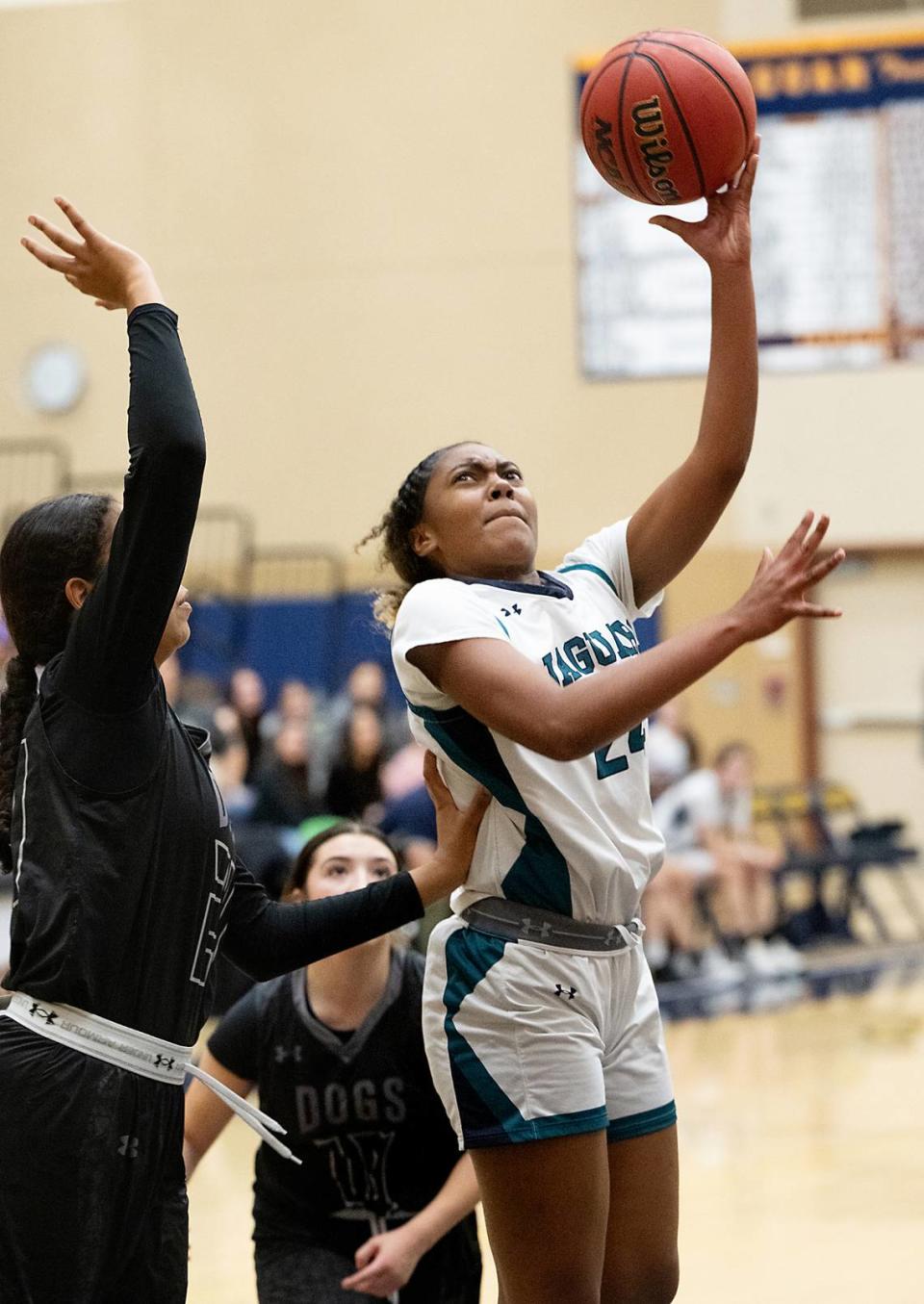 Gregori’s Veronica Whitten shoots over a Tracy defender during the tournament game at Gregori High School in Modesto, Calif., Friday, Dec. 8, 2023.