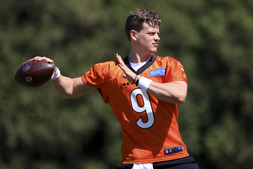 Cincinnati Bengals' Joe Burrow throws a pass during NFL football practice in Cincinnati, Tuesday, May 17, 2022. (AP Photo/Aaron Doster)