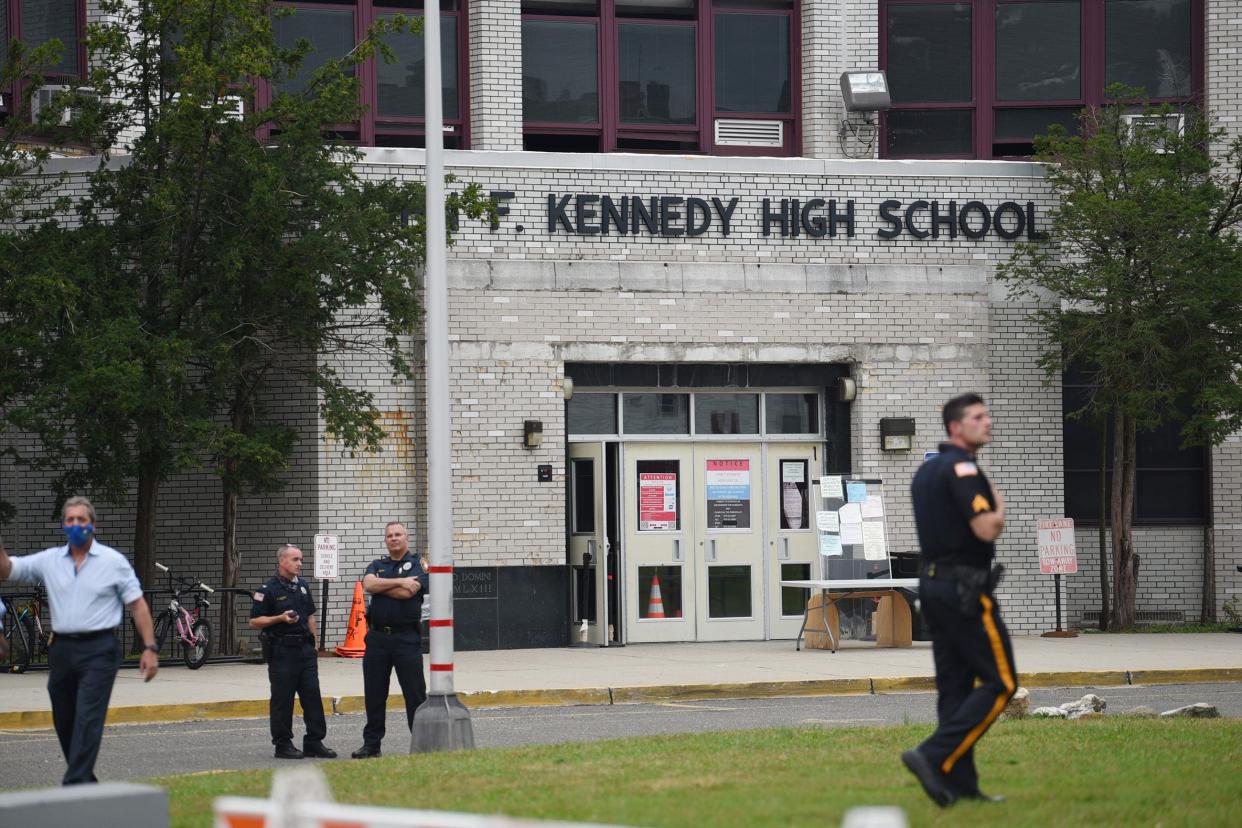 Paterson police stand outside John F. Kennedy High School in Paterson after it was put on lockdown Wednesday, Oct. 13, 2021.