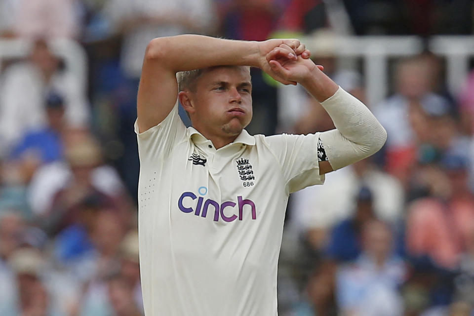England's Sam Curran reacts while bowling during play on the fourth day of the second cricket Test match  between England and India at Lord's cricket ground in London on August 15, 2021. (Photo by IAN KINGTON/AFP via Getty Images)