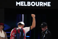 Tommy Paul of the U.S. waves as he leaves Rod Laver Arena following his semifinal loss to Novak Djokovic of Serbia at the Australian Open tennis championship in Melbourne, Australia, Friday, Jan. 27, 2023. (AP Photo/Aaron Favila)