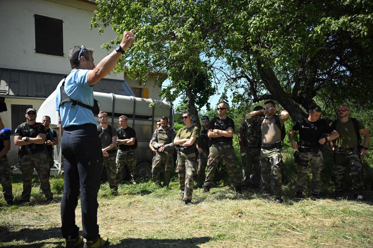 French gendarmes being briefed for a search operation for Emile earlier this week (AFP via Getty Images)