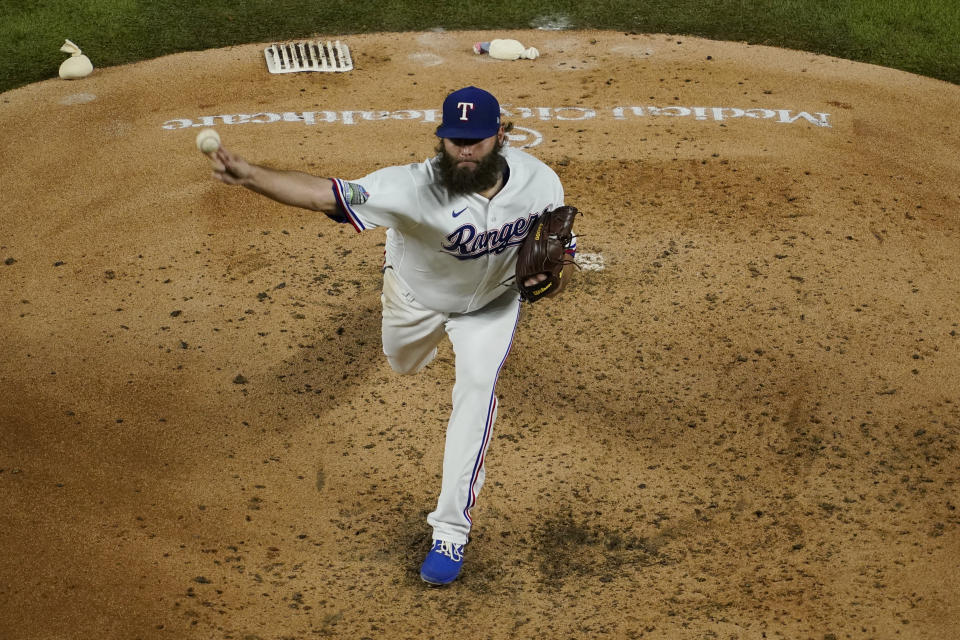 Texas Rangers' Lance Lynn pitches in the third inning of a baseball game against the Houston Astros in Arlington, Texas, Thursday, Sept. 24, 2020. (AP Photo/Tony Gutierrez)