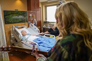 HunterGirl visits the bedsides of patients at the Nashville VA Medical Center during Musicians On Call's Concert For Veterans Presented by Wrangler