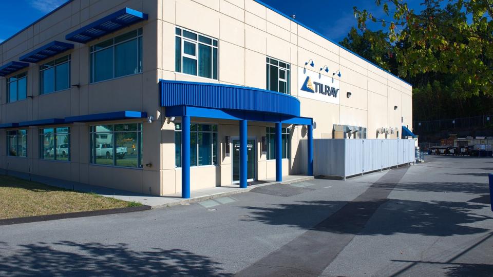 Building with Tilray logo on the side, with empty parking lot.