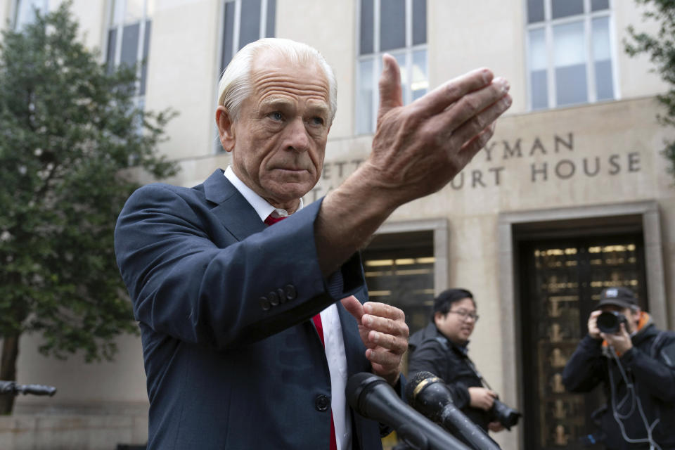 Former Trump White House official Peter Navarro talks to the media as he arrives at U.S. Federal Courthouse in Washington, Thursday, Jan. 25, 2024. (AP Photo/Jose Luis Magana)