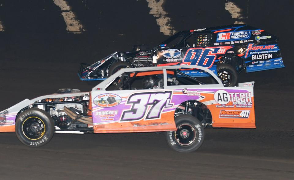 Michael Ledford (37) pulled along side of Mike McKinney and was able to stick his nose in front during the modified feature Saturday at Fairbury Speedway. However, McKinney was able to break away from Ledford and record the win.