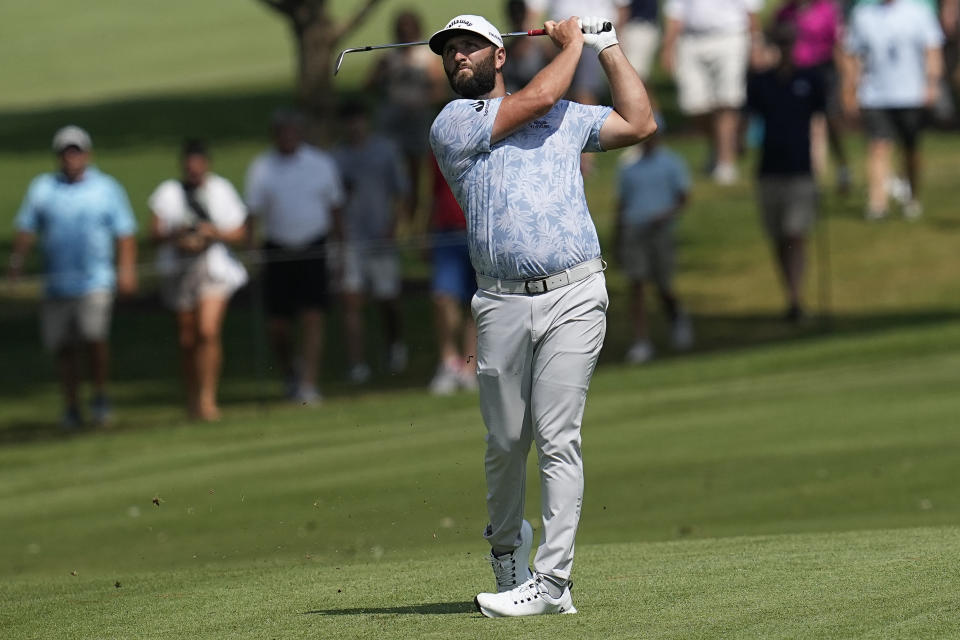 Jon Rahm hits from the fifth fairway during the third round of the Tour Championship golf tournament, Saturday, Aug. 26, 2023, in Atlanta. (AP Photo/Mike Stewart)