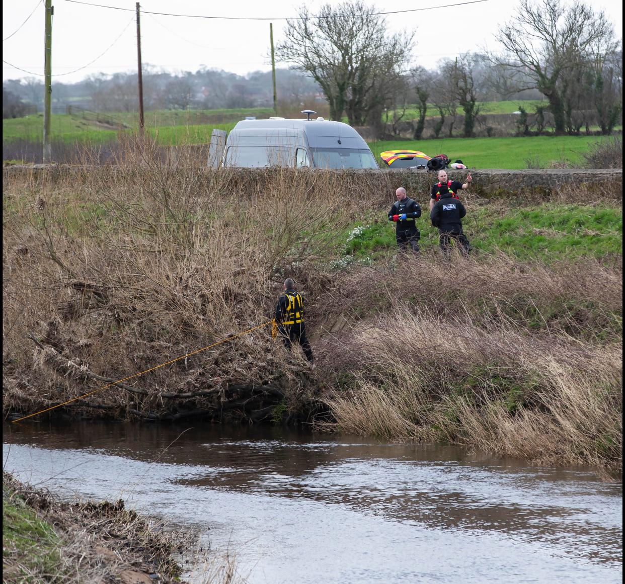 A police diving team at the River Wyre near St Michael's on Wyre (Jason Roberts/PA Wire)