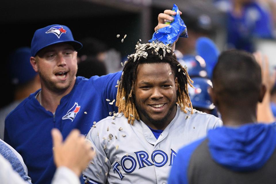 Jul 20, 2019; Detroit, MI, USA; Toronto Blue Jays third baseman Vladimir Guerrero Jr. (27) celebrates his grand slam home run with teammates during the fifth inning against the Detroit Tigers at Comerica Park. Mandatory Credit: Tim Fuller-USA TODAY Sports