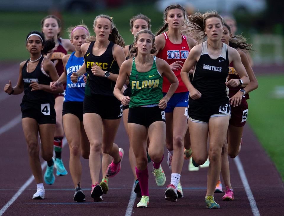 Runners stay close in the 3200 Meter Run during the IHSAA Girls Track & Field Regionals at the Central High School's Central Stadium Tuesday evening, May 24, 2022. Floyd Central's Jaydon Cirincione won in 11:06:29.